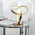 Lampada da scrivania piccola a forma di trifoglio dorato, alimentata tramite USB.